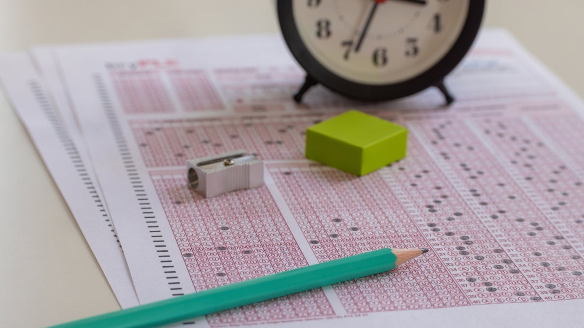 Photo of exam pencil and clock