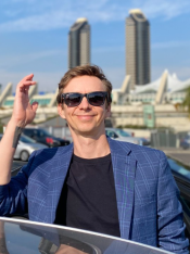 Maxim Tarasov outside in blue suit jacket